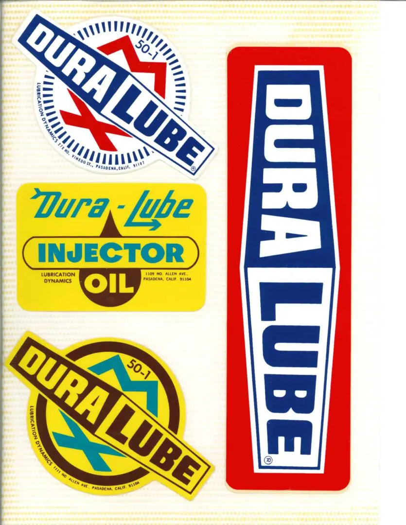 A set of stickers with the words dura lube.