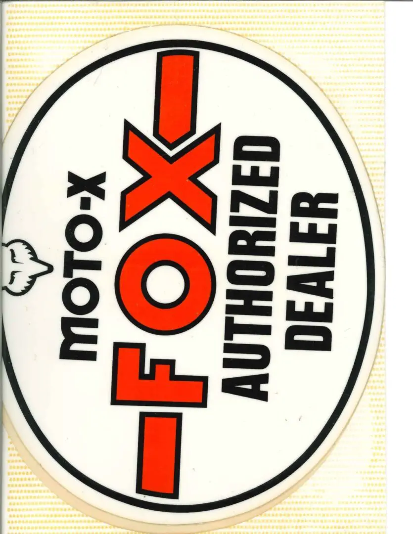 A moto fox authorized dealer sticker on a white background.