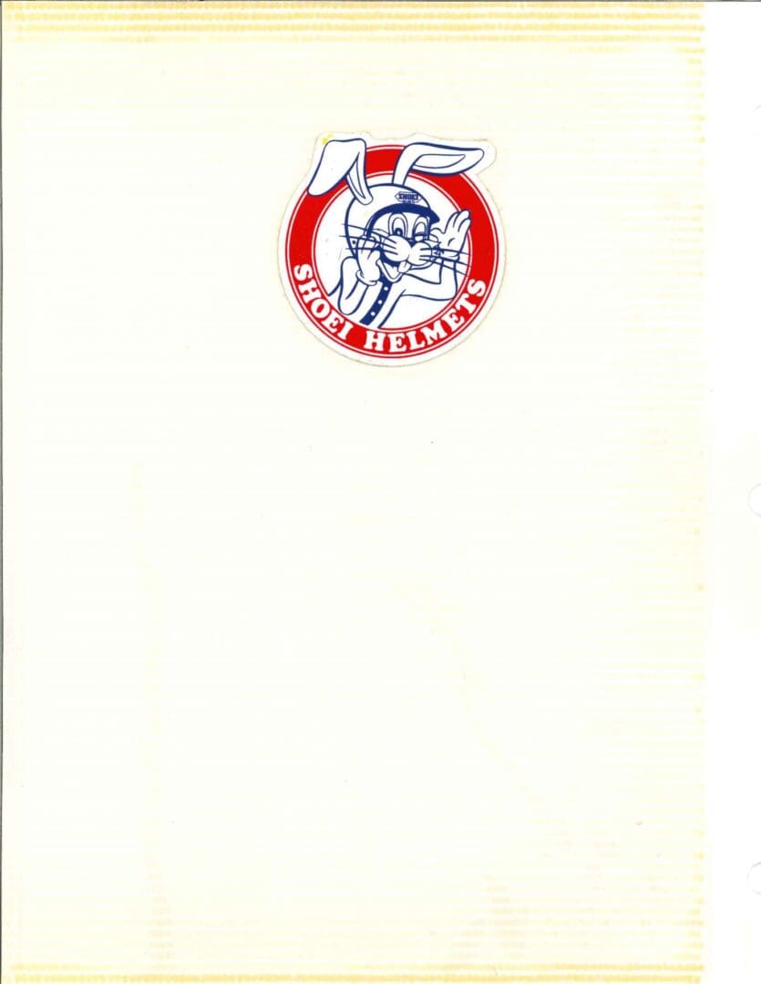 A notebook with a red and white logo on it.