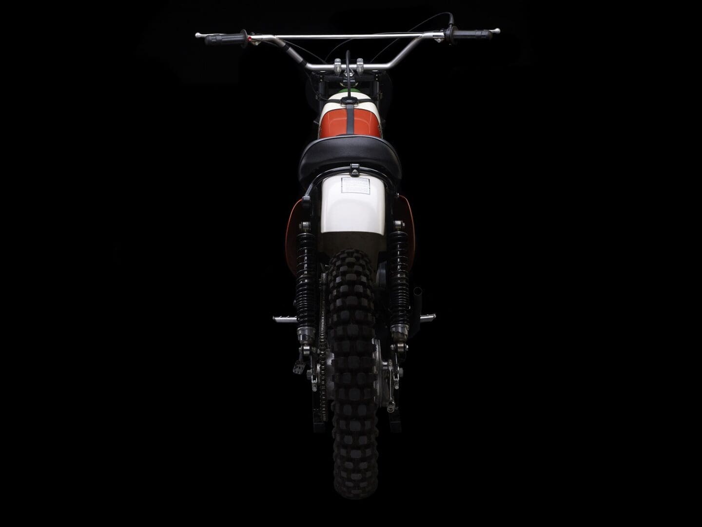 A dirt bike is shown against a black background.