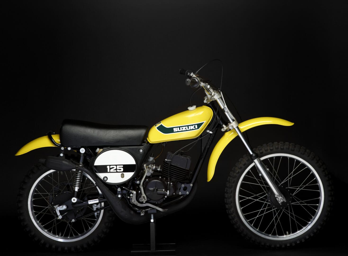 1973 Suzuki TM125K bike on black background