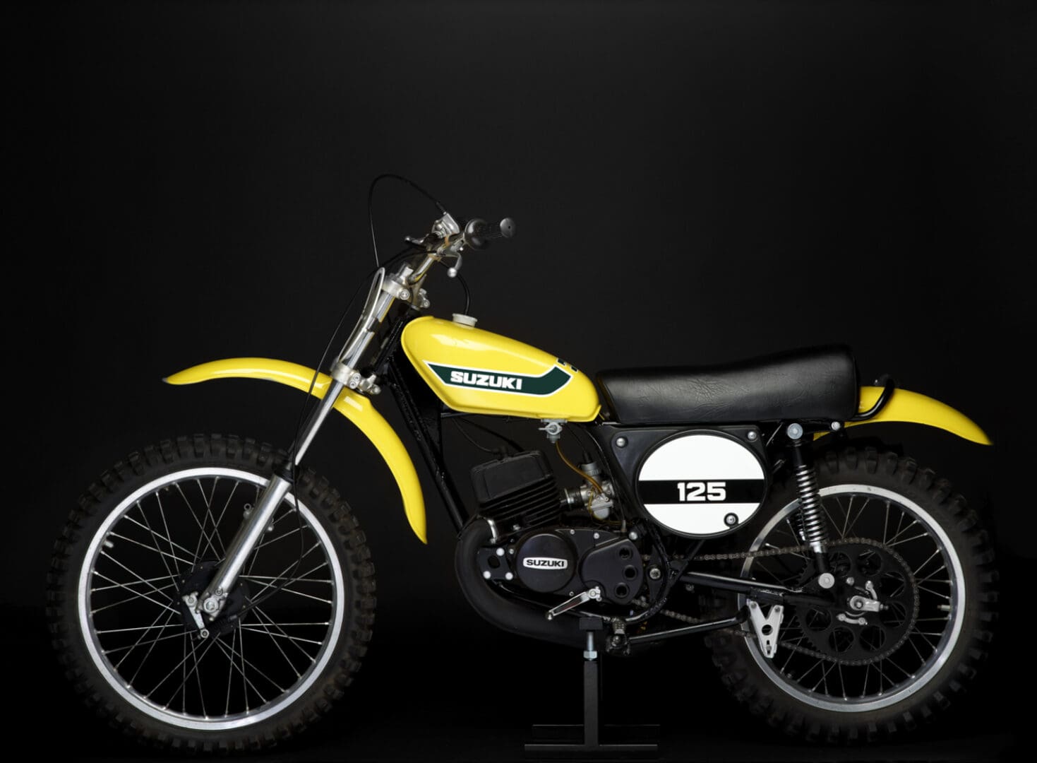 1973 Suzuki TM125K bike on black background