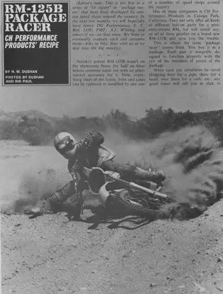 A vintage black and white photo capturing a dirt bike racer in action.