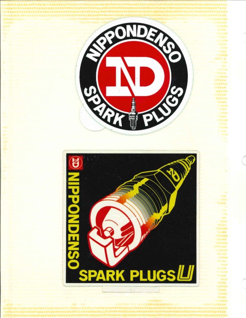 A sticker with an image of a spark plug.
