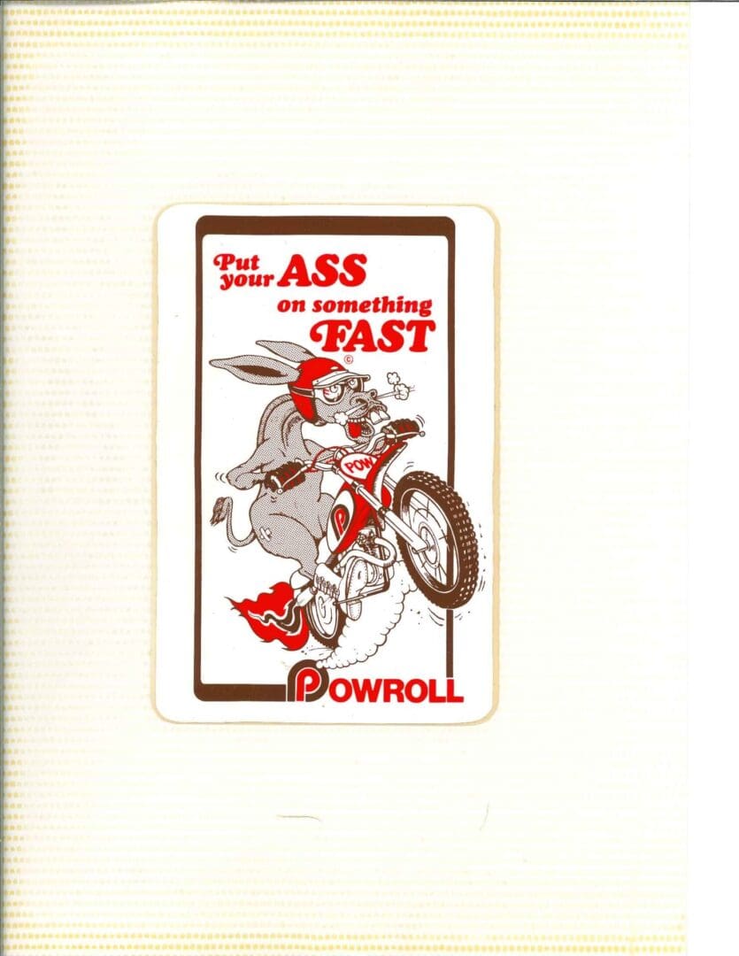 A card with an image of a rabbit riding a motorcycle.