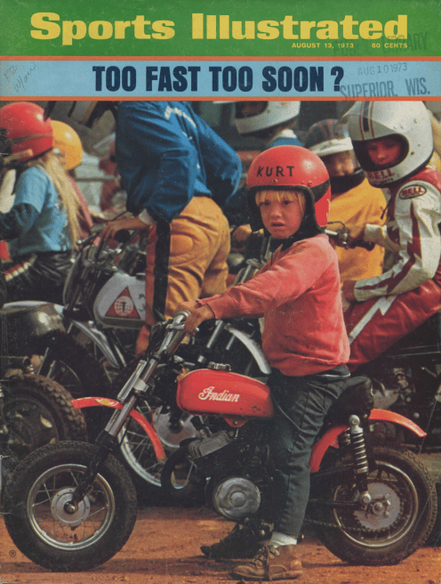 A young boy riding a motorcycle on the cover of Sports Illustrated, featured in a vintage article.