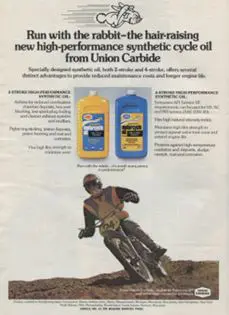A vintage ad for a bike oil featuring a man riding a bike.