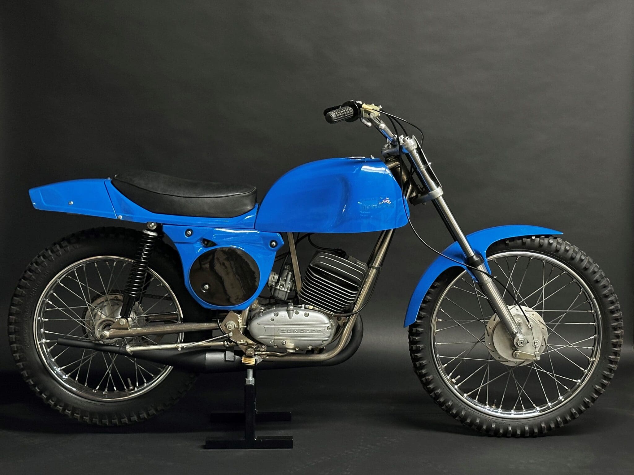 A Blue Color Bike With a Single Seat, Image From Right