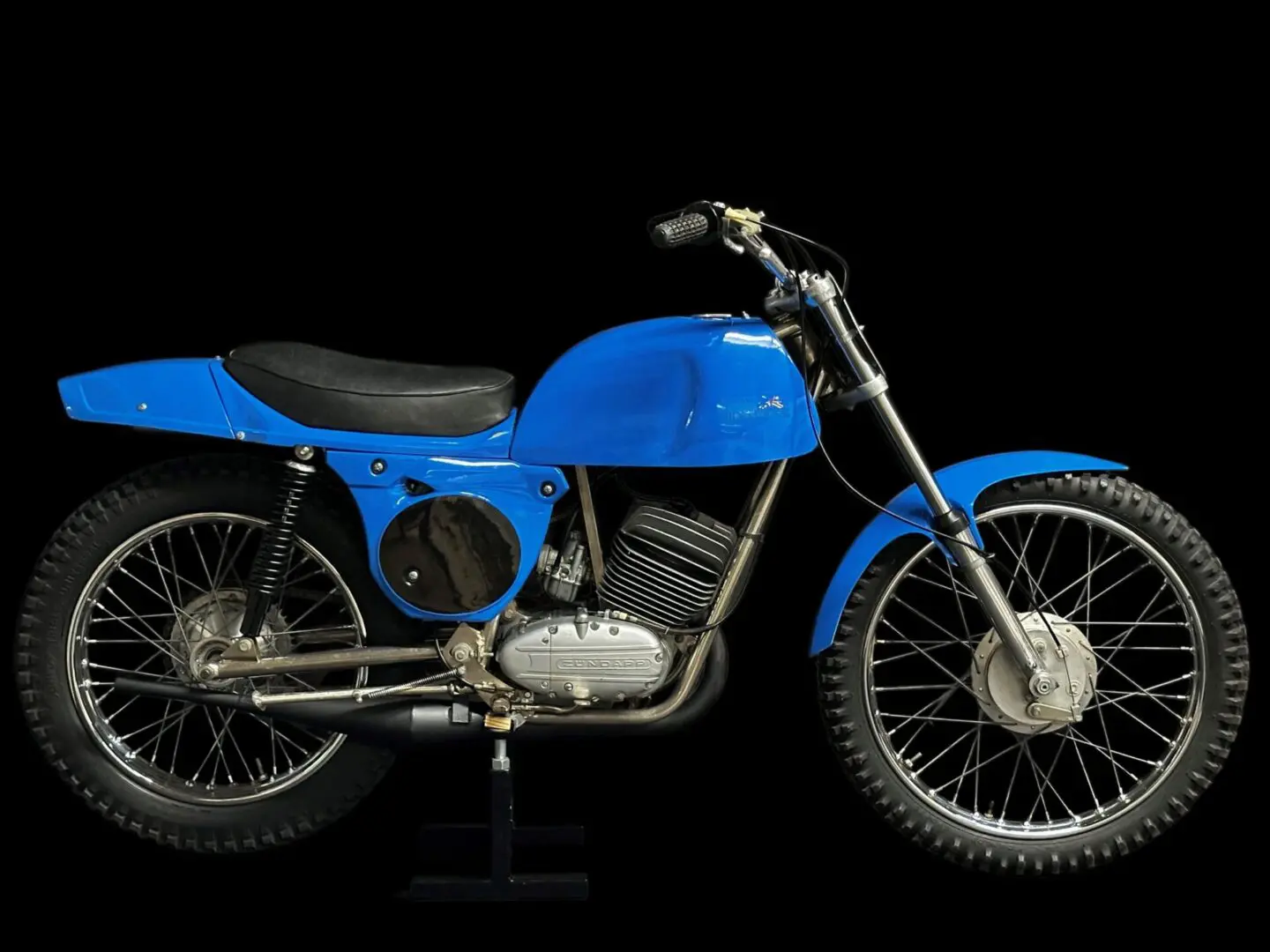 A Blue Color Bike With a Single Seat Image Section
